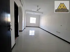 For annual rent in Al Rawda 3: 2-bedroom apartment with hall, 2 bathrooms, central AC, AED 36,000 y
