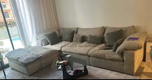 Large L-shaped Gray fabric sectional sofa with ottoman - good condition