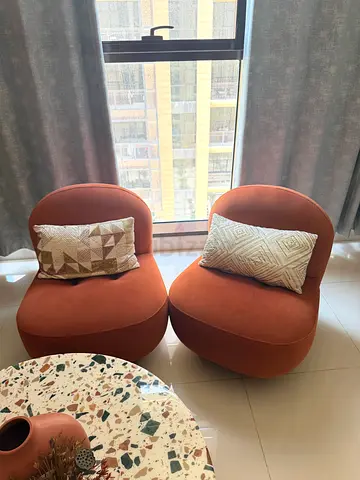 Pair of orange/brown upholstered lounge chairs (good condition)