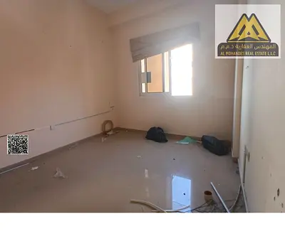 For annual rent in Al Jurf 2, Ajman: 1-bedroom apartment with hall, closed kitchen, central AC, fre