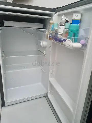 Compact single-door mini fridge in good working condition