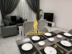 Luxury two-bedroom apartment with a living room in Ajman - Al Rashidiya 1 - Oasis Towers - brand new