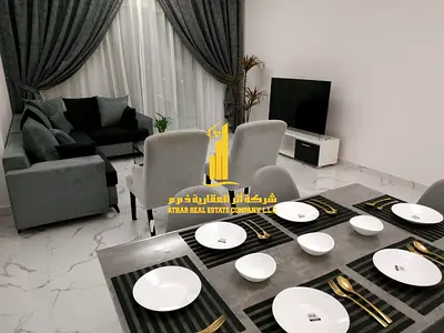 Luxury two-bedroom apartment with a living room in Ajman - Al Rashidiya 1 - Oasis Towers - brand new furnishings available for monthly rent