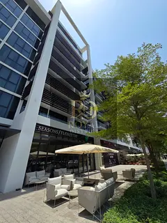 High ROI | Modern 1BR with American Kitchen &amp; Boulevard View in Misk, Aljada