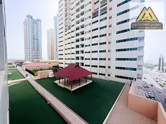 For annual rent in Ajman One Towers: 1BR apartment with hall, balcony, 2 bathrooms, free parking, ce