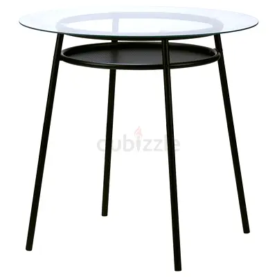 IKEA Round glass top dining table with black metal frame and shelf