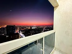 Fully furnished 2-bedroom apartment with a living room in Al Nuaimiya 1, located next to Al Ain Mark
