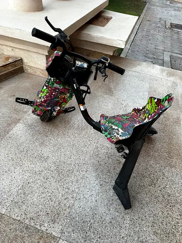 Used three-wheel electric drift scooter with colorful deck