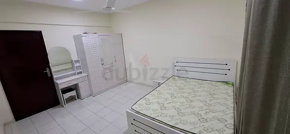 MASTER ROOM WITH ATTACHED BALCONY FOR RENT NEAR TO RIGGA PORTSAEED CLOCKTOWER MURAQABAT