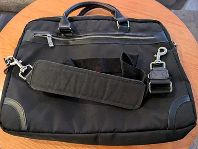 Black laptop briefcase with shoulder strap, good condition