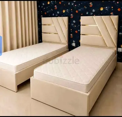 Pair of single beds with upholstered headboards and mattresses - navy blue