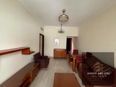 Furnished bedroom and living room for annual rent in Al Jurf 2, near the court, directly near Nesto supermarket and Al Wataniya School, and on Sheikh