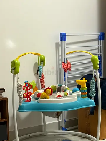 Baby jumper activity center with toys - gently used
