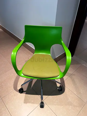 Modern green fabric plastic desk chair with 5 wheels, slight stain on seat (see photo)