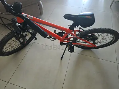 Orange kids/teen mountain bike - good condition 20 inch