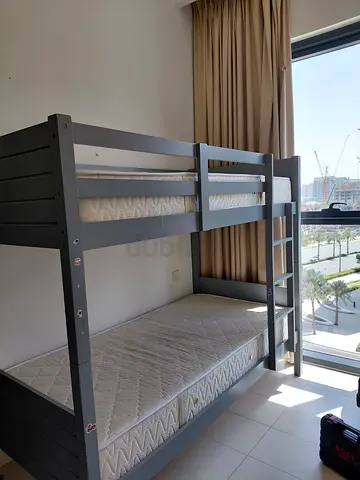 Solid wood grey bunk bed with two mattresses - good condition