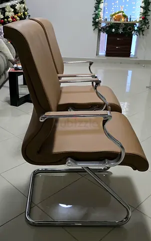 Pair of brown leather guest chairs with chrome frame
