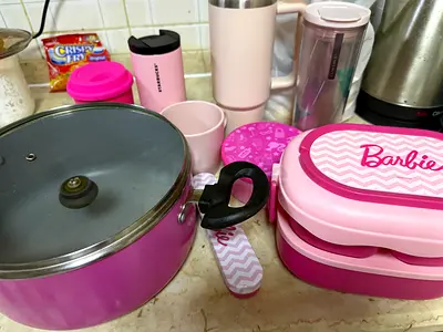 Assorted pink kitchenware set — pots, lunchboxes, mugs and accessories
