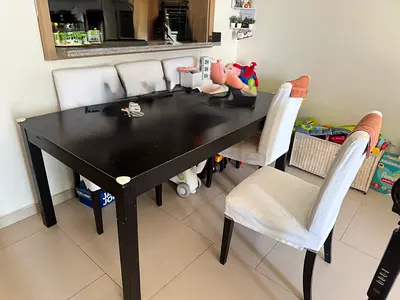 Solid black dining table with 6 chairs (used) - sturdy rectangular set