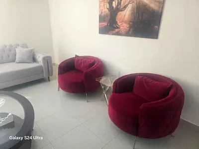 Light grey tufted 2-seater sofa in good condition