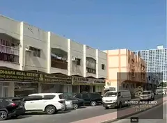Existing building on a main road in Al Nuaimiya 3, Ajman, generating immediate income with potential