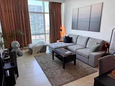 IKEA 3 seater , Like new Grey Sectional Sofa with Matching Ottoman 3 tables wallart