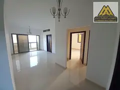 Two bedrooms and a large living room with a balcony in the Al-Aliya area, next to Mohammed Bin Zayed