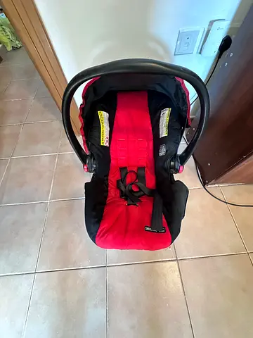 Red and black infant car seat with base (rear-facing) - good condition