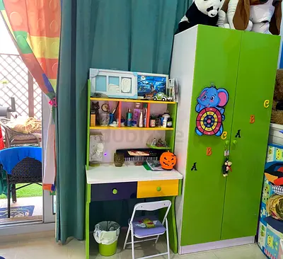 Multi colours kids wardrobe with matching study desk and storage -set without the slide.Curtains too