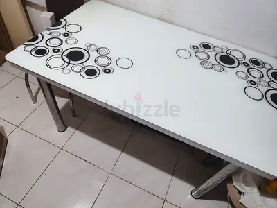 White glass dining table with black circle pattern - used