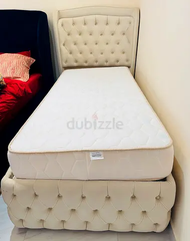 Upholstered single bed with mattress