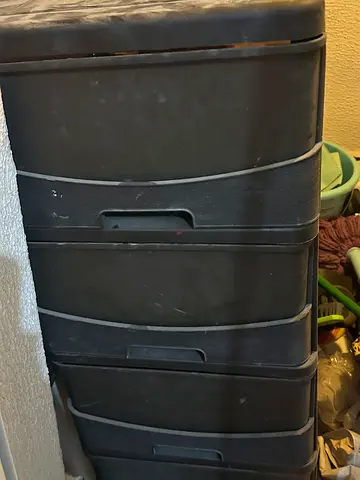Tall black plastic storage cabinet with shelves - good condition