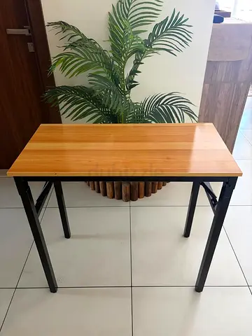 Compact wooden top folding table with metal legs