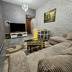 Luxury one-bedroom apartment in Ajman - Al Rashidiya 1 - Pearl Towers - furnished with hotel-style f