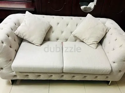 Beige tufted 3  2-seater sofa in good condition
