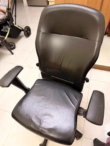 Black leather office chair 360° swivel rotation Height adjustable Strong and durable