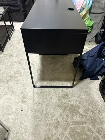 Black minimalist bedside table with drawer
