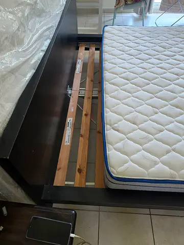 Kimg size wooden bed frame with mattress - good condition. Single King Size mattress. Both being so