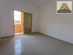 Two bedrooms and a large living room with a balcony offering an open view, located in Al Jurf 3 area