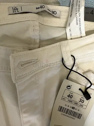 White high-waist jeans, size EU 40 (new with tags)