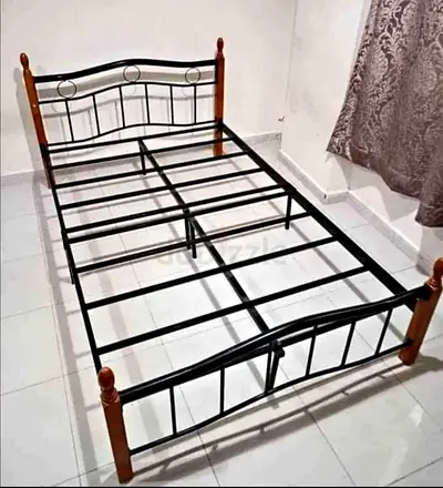 Double size  metal bed frame with wooden posts -