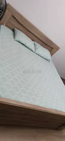 Queen wooden bed frame with mattress and pillows - good condition