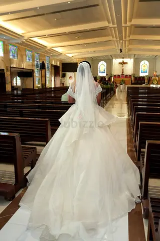 Used white wedding dress with long train and veil