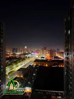A one-bedroom apartment with a living room is available for annual rent in Al Madina City Tower. It