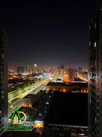 A one-bedroom apartment with a living room is available for annual rent in Al Madina City Tower. It is strategically located opposite Grand Mall and b