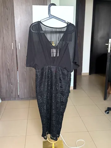 Black cocktail dress with lace skirt and sheer top - size tag attached
