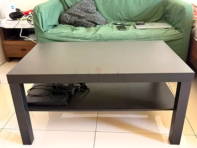 Simple black wooden coffee table with lower shelf - good condition