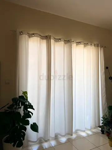 Modern White Grommet Curtains with rod and holding clips