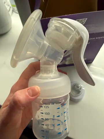 Manual breast pump with 125ml feeding bottle - gently used