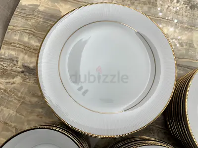 Set of white porcelain dinner plates with gold rim (used)